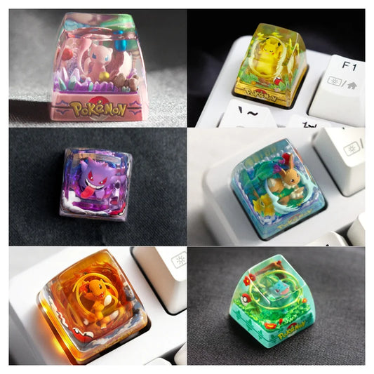 Six handmade resin mechanical keyboard keycaps featuring Mew, Pikachu, Gengar, Eevee, Charmander, and Bulbasaur.