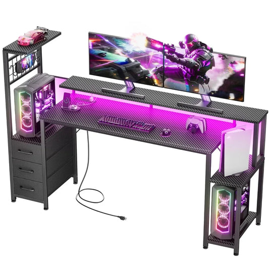 Black carbon-fiber gaming desk with pink LED lights, monitor stand, keyboard, mouse, drawers, shelves, and a PC tower.