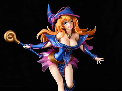 Anime figure in blue and pink wizard outfit with tall hat, holding a staff with a gold swirled top.
