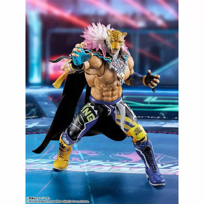 Muscular Tekken 8 King action figure with leopard mask, pink and white mane, black cape, and blue and yellow tights.