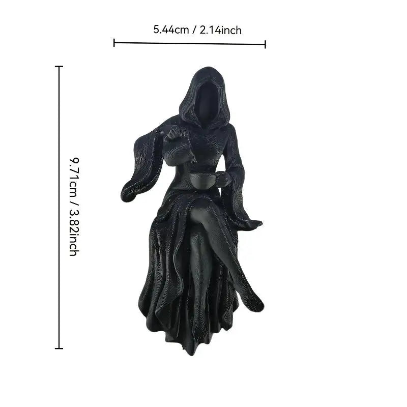 Black resin statue of a hooded figure holding a teacup, with dimension lines indicating a height of 9.71cm.