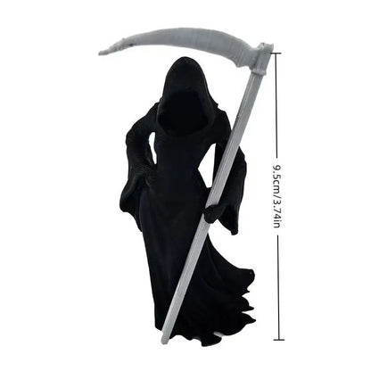 Black female Grim Reaper statue holding a large grey scythe, measuring 9.5cm tall.
