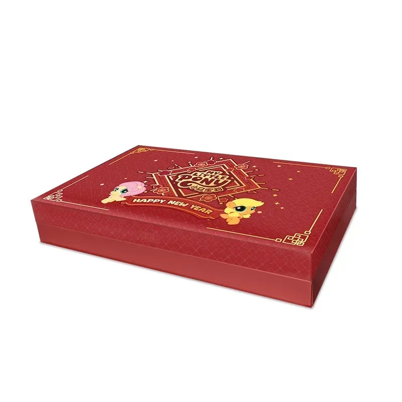Red My Little Pony card box with gold floral details, "Happy New Year" banner, and two pony characters.