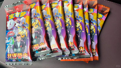 Eight Pokémon card booster packs in orange, red, and blue with character artwork featuring Mewtwo.