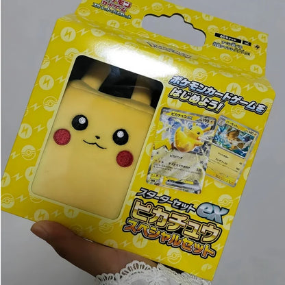 Yellow Pikachu card storage box set with plush case, featuring Pikachu EX and Pawmot cards on the box.