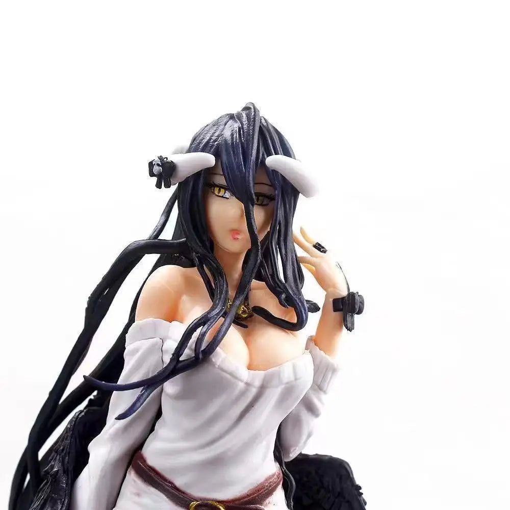 Close-up of Albedo figure with long dark hair, white horns, gold eyes, and a white off-shoulder top.