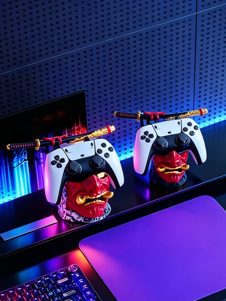 Two red oni mask controller holders with white game controllers and miniature samurai swords.