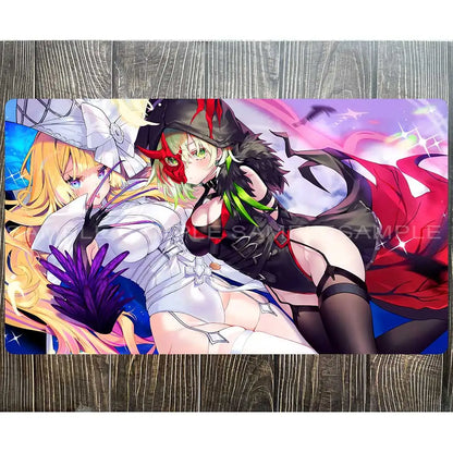 A Yu-Gi-Oh playmat features two anime women. One has blonde hair and white clothing; the other has green hair and a black outfit.