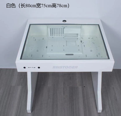 A white computer chassis desk features a glass top, internal mounting brackets, and front ports.