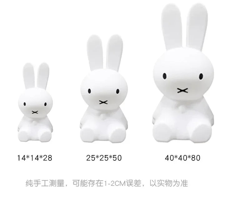 Three white Miffy rabbit night lights of increasing sizes with dimension labels underneath.