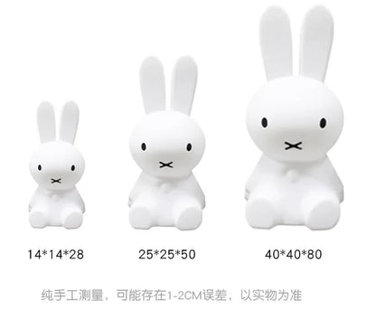 Three white Miffy rabbit night lights of increasing sizes with dimension labels underneath.