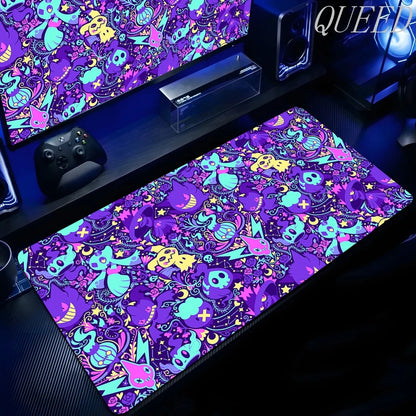 An XXL gaming mouse pad features a repeating Gengar pattern in purple, blue, yellow, and pink with skulls and stars.