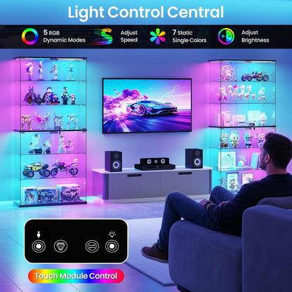Two black 6-tier glass curio cabinets flank a TV, illuminated by glowing RGB LED lights showcasing collectibles.