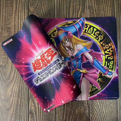 Dark Magician Girl playmat featuring purple, pink, and gold tones with the Yu-Gi-Oh logo.