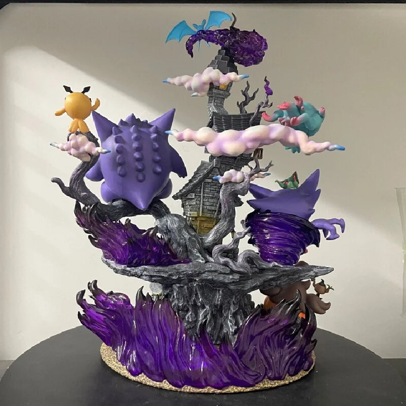 Colorful Gengar evolution figurine featuring Gengar, Gastly, and Haunter on a spooky rock diorama.