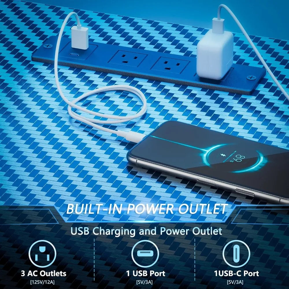 Blue carbon-fiber textured desk with a built-in power strip holding a phone, USB-C, and power adapter.