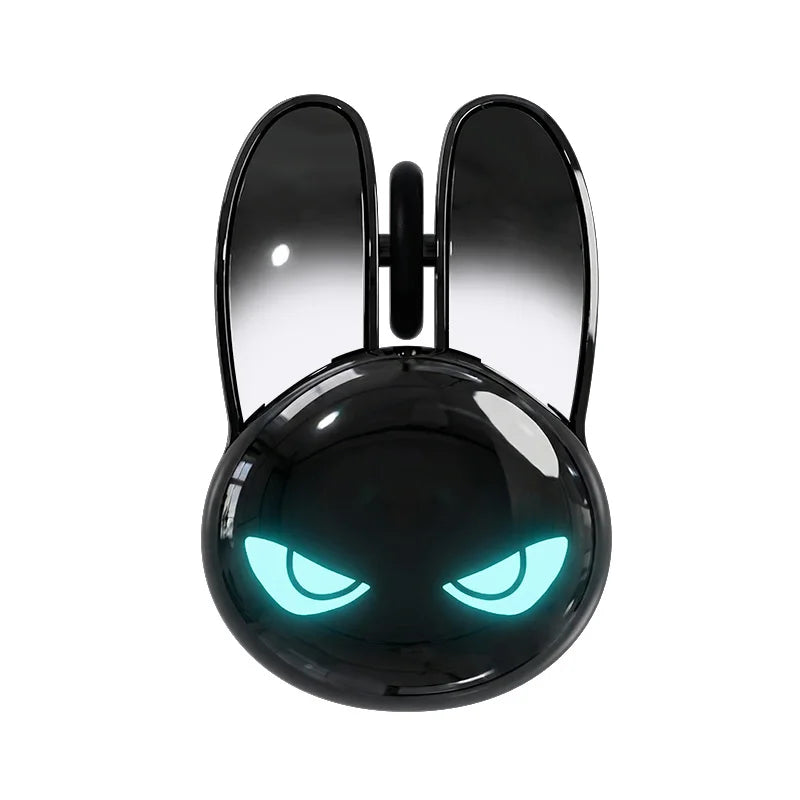 Glossy black rabbit-shaped wireless mouse with glowing teal angry eyes and tall click buttons.