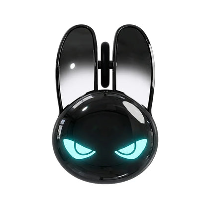 Glossy black rabbit-shaped wireless mouse with glowing teal angry eyes and tall click buttons.
