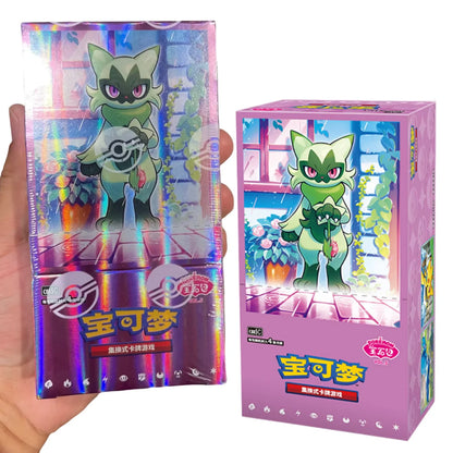 Two purple Pokémon booster boxes feature Sprigatito holding a flower in front of a window, with foil accents.