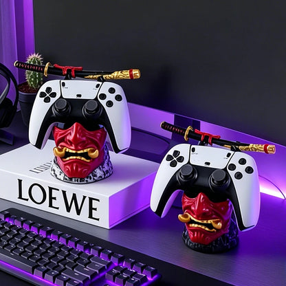Red and gold oni mask controller stands hold game controllers and decorative samurai swords.