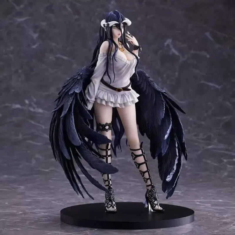 Albedo figurine with long black hair, white off-shoulder dress, large black wings, and strapped boots on a round black base.