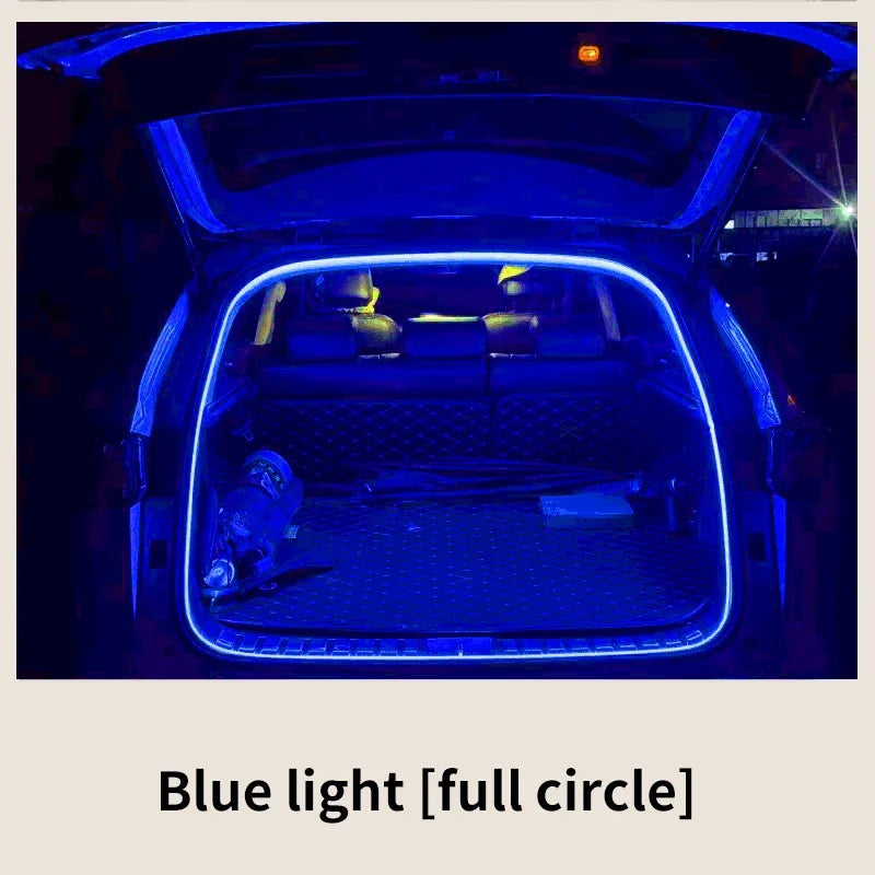 An open car trunk illuminated by a flexible blue LED strip outlining the interior frame.
