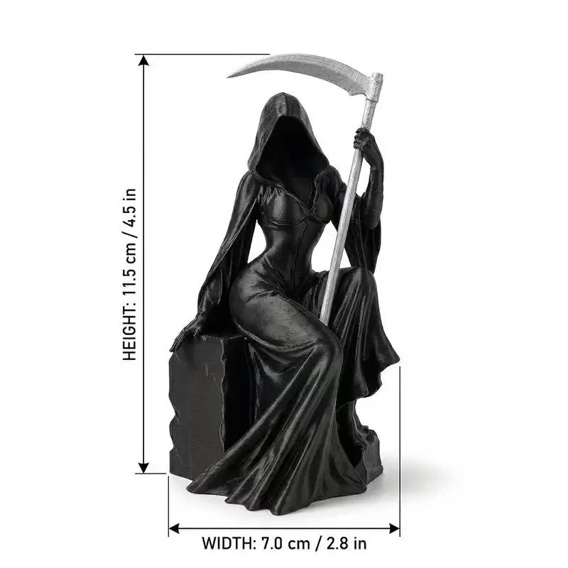 A black female Grim Reaper statue sits on a rock, holding a silver scythe, with dimension markers showing a height of 11.5 cm.