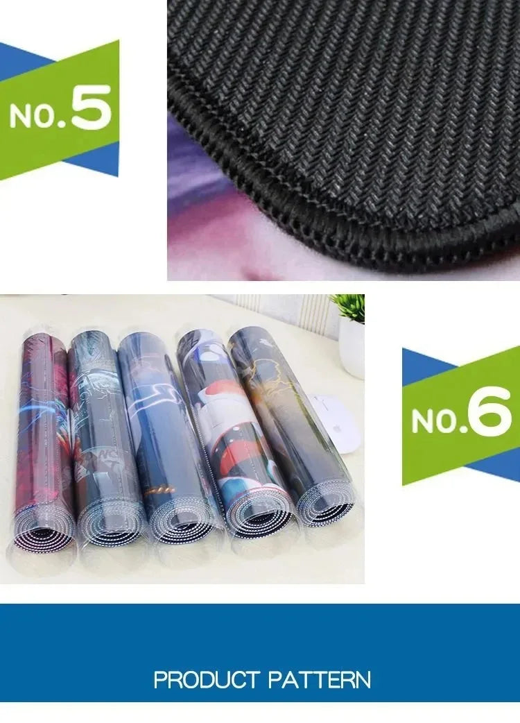 Close-up of black stitched desk mat edge, and five rolled gaming mouse pads in plastic.