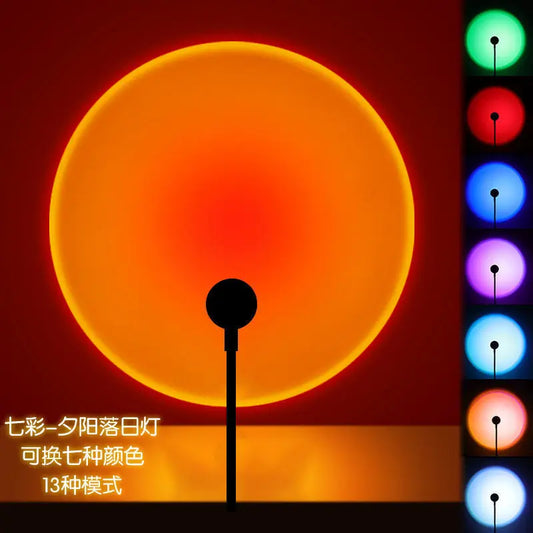 A black standing sunset lamp projects a large orange-red circle, with vertical color swatches on the right.