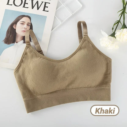 Khaki ribbed seamless bralette with wide straps, presented alongside a magazine page and white flowers.