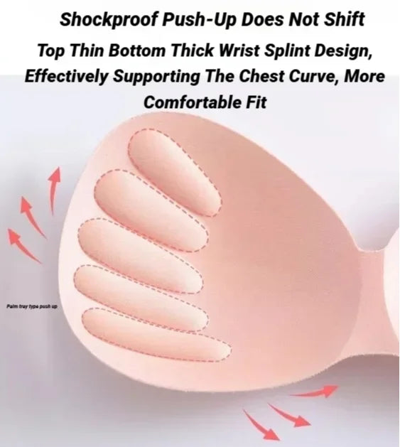 Pink wireless bra cup with internal hand-shaped padding and descriptive text.