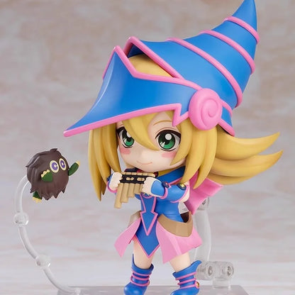Chibi Dark Magician Girl figure in blue and pink, playing a flute with a small Kuriboh floating nearby.