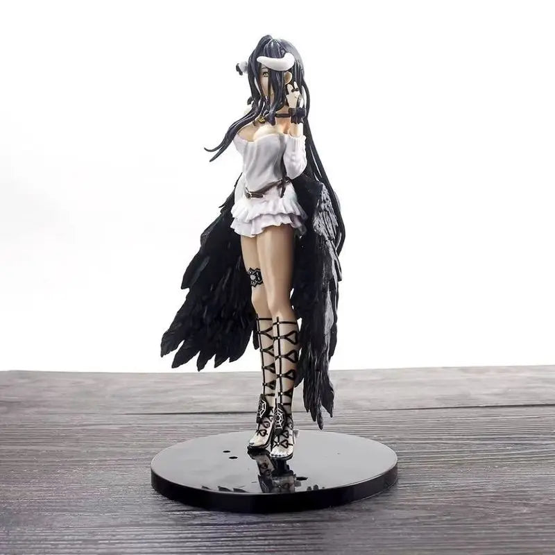 Albedo anime figure in a white dress, black feathered wings, and tall lace-up boots on a black base.