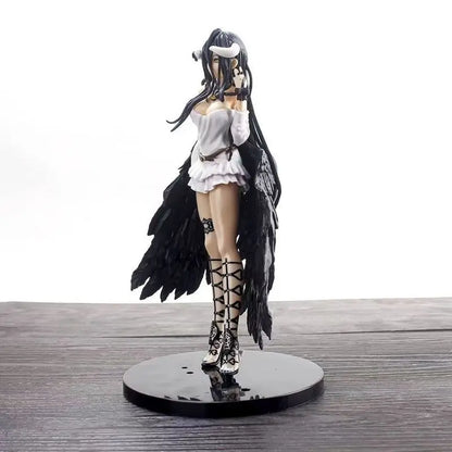 Albedo anime figure in a white dress, black feathered wings, and tall lace-up boots on a black base.
