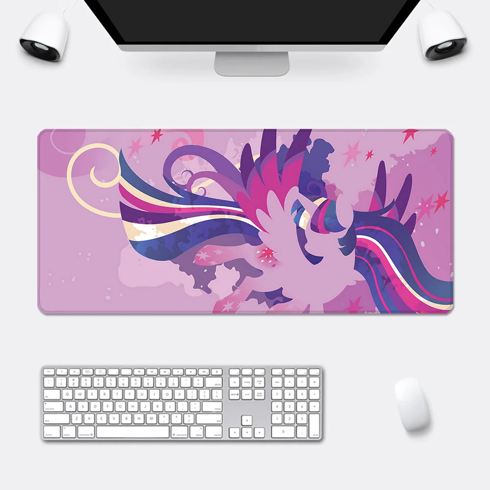 An XXL pink mousepad features an abstract, winged My Little Pony character with purple and blue hair, set against a pink star-filled background.
