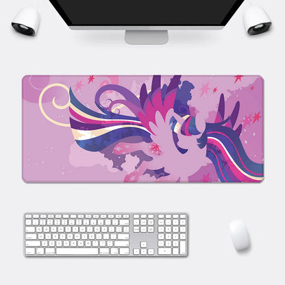 An XXL pink mousepad features an abstract, winged My Little Pony character with purple and blue hair, set against a pink star-filled background.