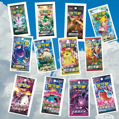 Twelve colorful Chinese Pokémon card booster packs featuring characters like Pikachu and Charizard against clouds.