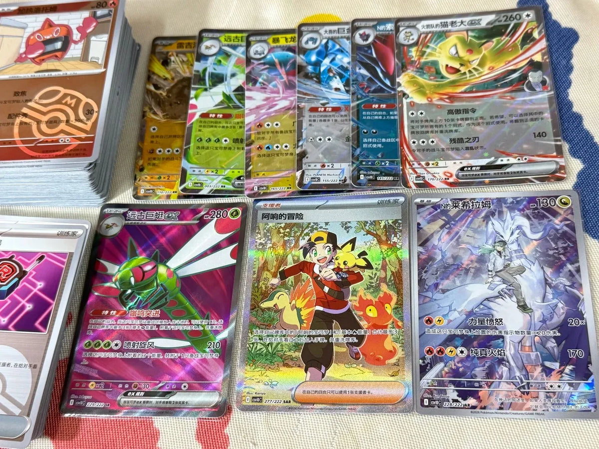 A display of multiple colorful Simplified Chinese Pokémon trading cards, featuring characters, creatures, and holographic details.