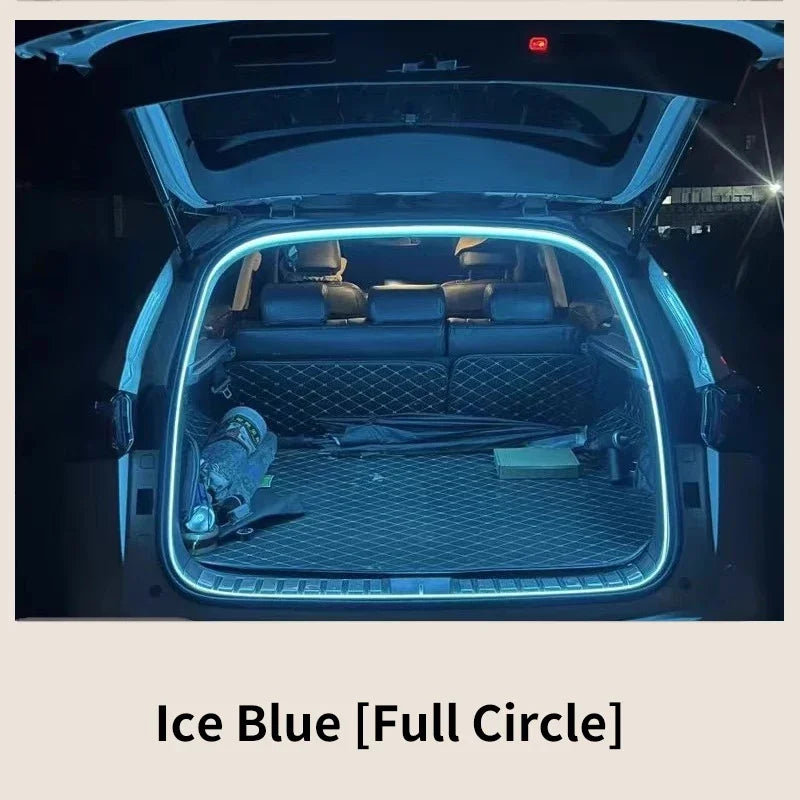 An open car trunk with an ice blue LED light strip outlining the frame.