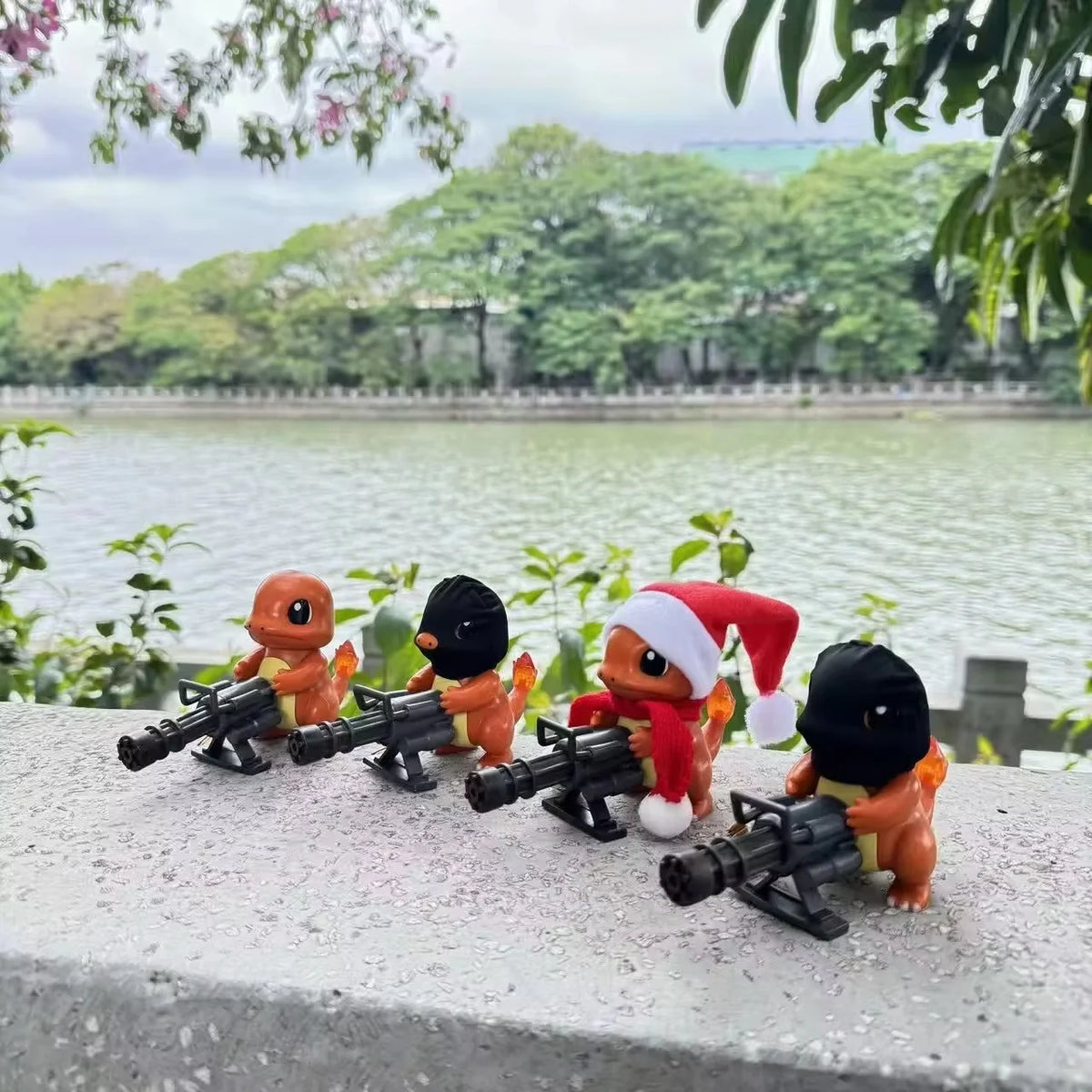 Four orange Charmander figurines holding black Gatling guns; two wear black masks, and one wears a Santa hat.