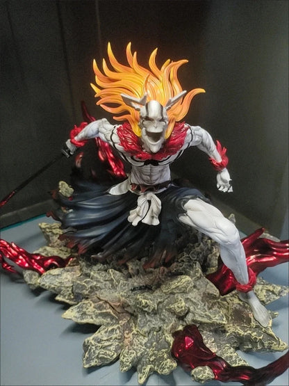 Bleach Ichigo figurine in hollow bull head form, with a white body, long orange hair, red accents, and a dark robe on a rocky base.