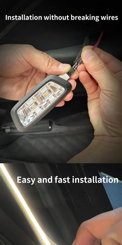 Hands connect wires to a black LED car trunk light housing with a white lens.