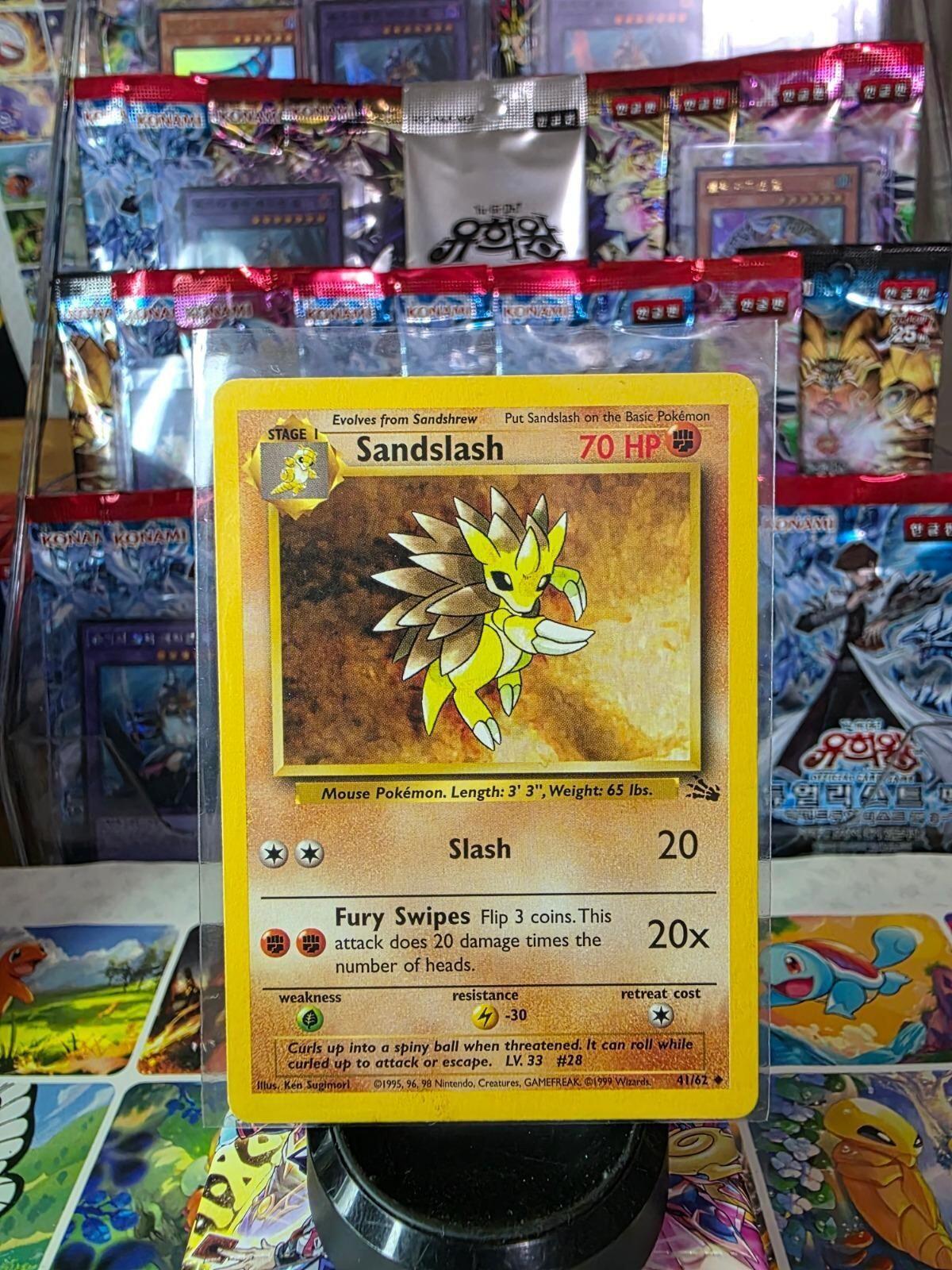 Sandslash Pokémon card in a protective sleeve with a yellow border and game stats.