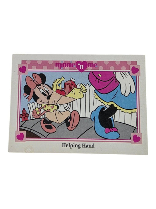 Minnie Mouse carries a paper grocery bag in this 1991 Disney trading card titled Helping Hand.