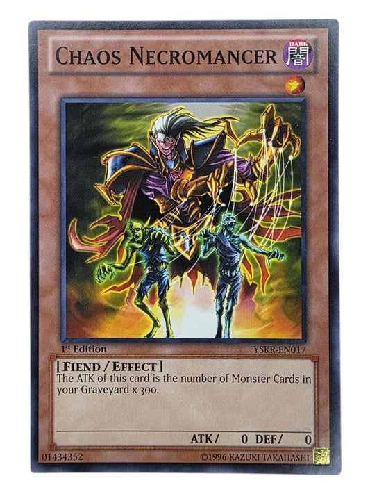 Chaos Necromancer Yu-Gi-Oh! card showing a necromancer controlling two zombies with strings.