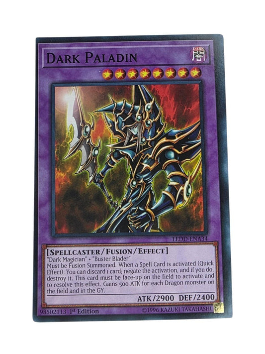 Dark Paladin 1st Edition Yu-Gi-Oh card featuring artwork of the armored spellcaster holding a staff.