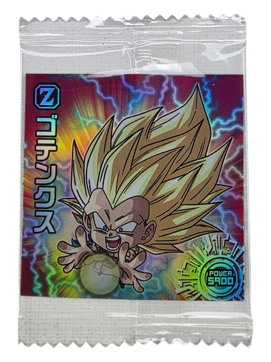 Sealed holo sticker featuring Super Saiyan 3 Gotenks with spiky blonde hair, charging an energy ball, on a red background.