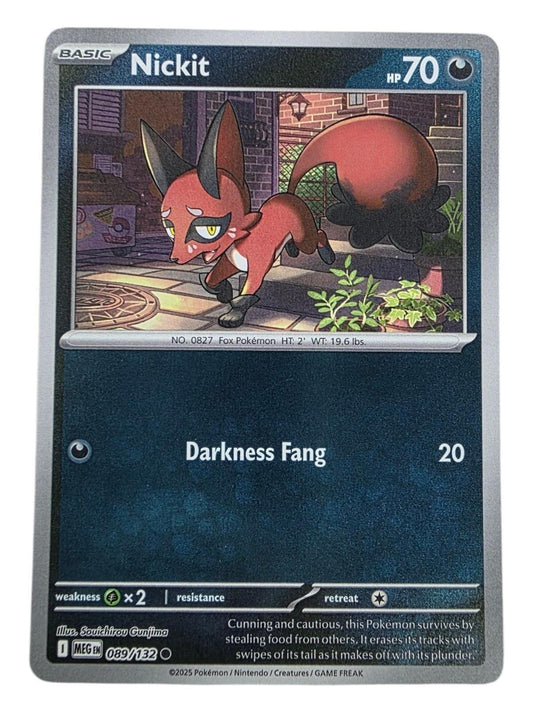 Nickit Pokémon trading card showing a red fox creature with a large black tail in an alleyway setting.