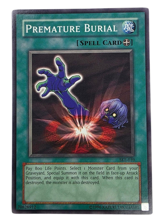Premature Burial Yu-Gi-Oh! Spell card with artwork showing a purple undead hand and head rising from the ground.