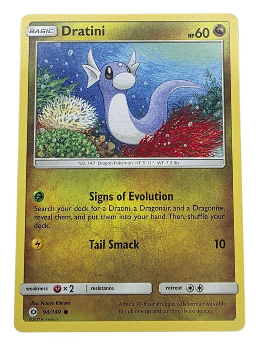 Dratini Pokémon trading card featuring underwater artwork and the "Signs of Evolution" attack.